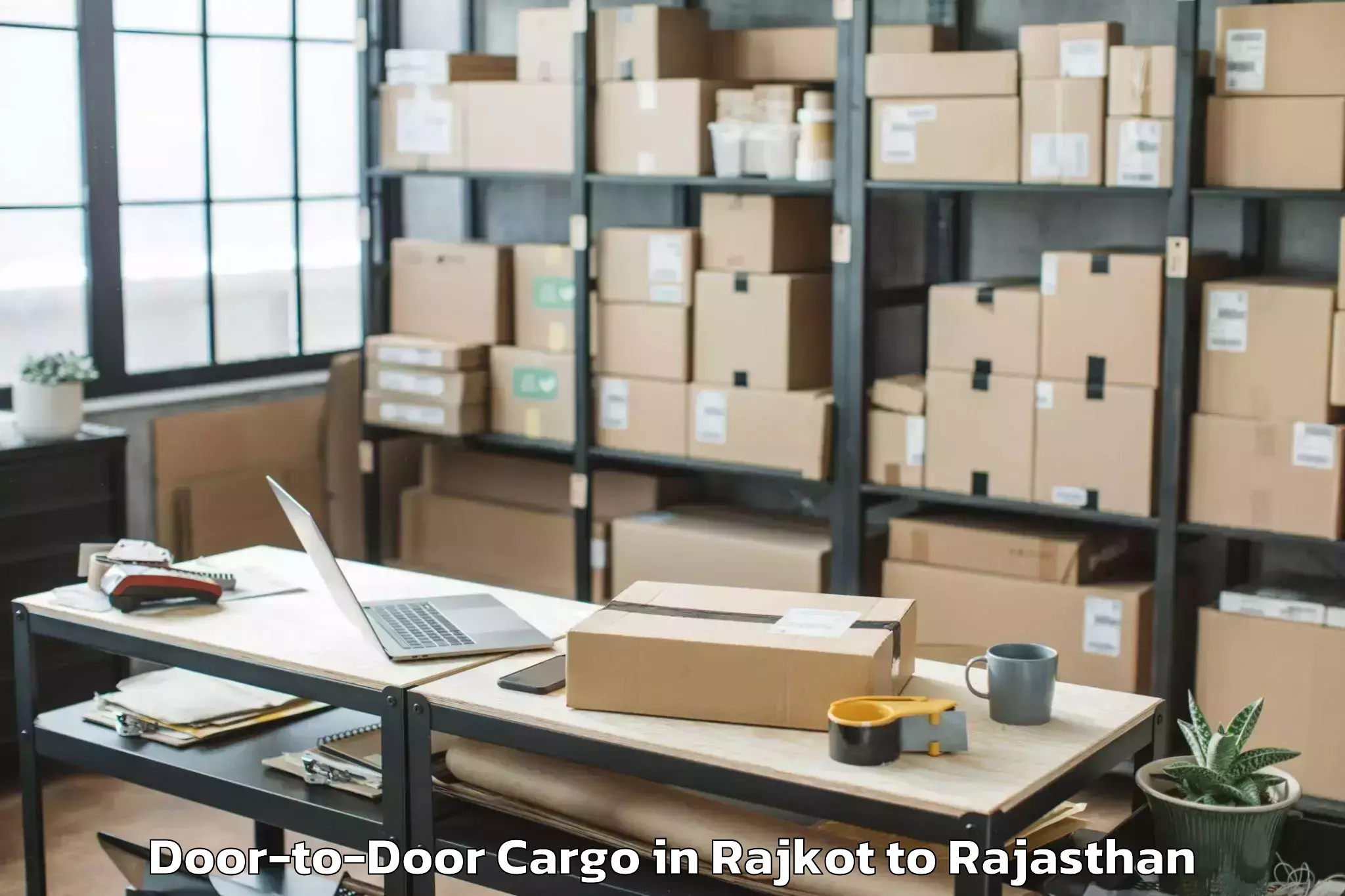 Affordable Rajkot to Karauli Door To Door Cargo